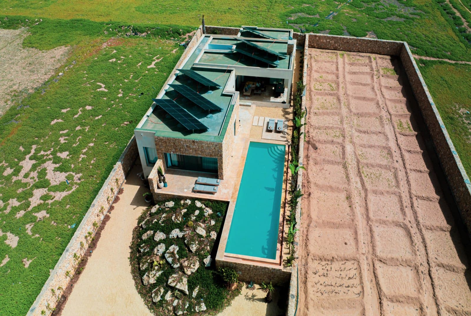 The villa and its pool seen from the sky